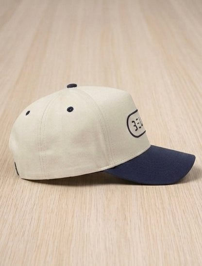 BELIEVE Snapback Hat – Cream/Navy
