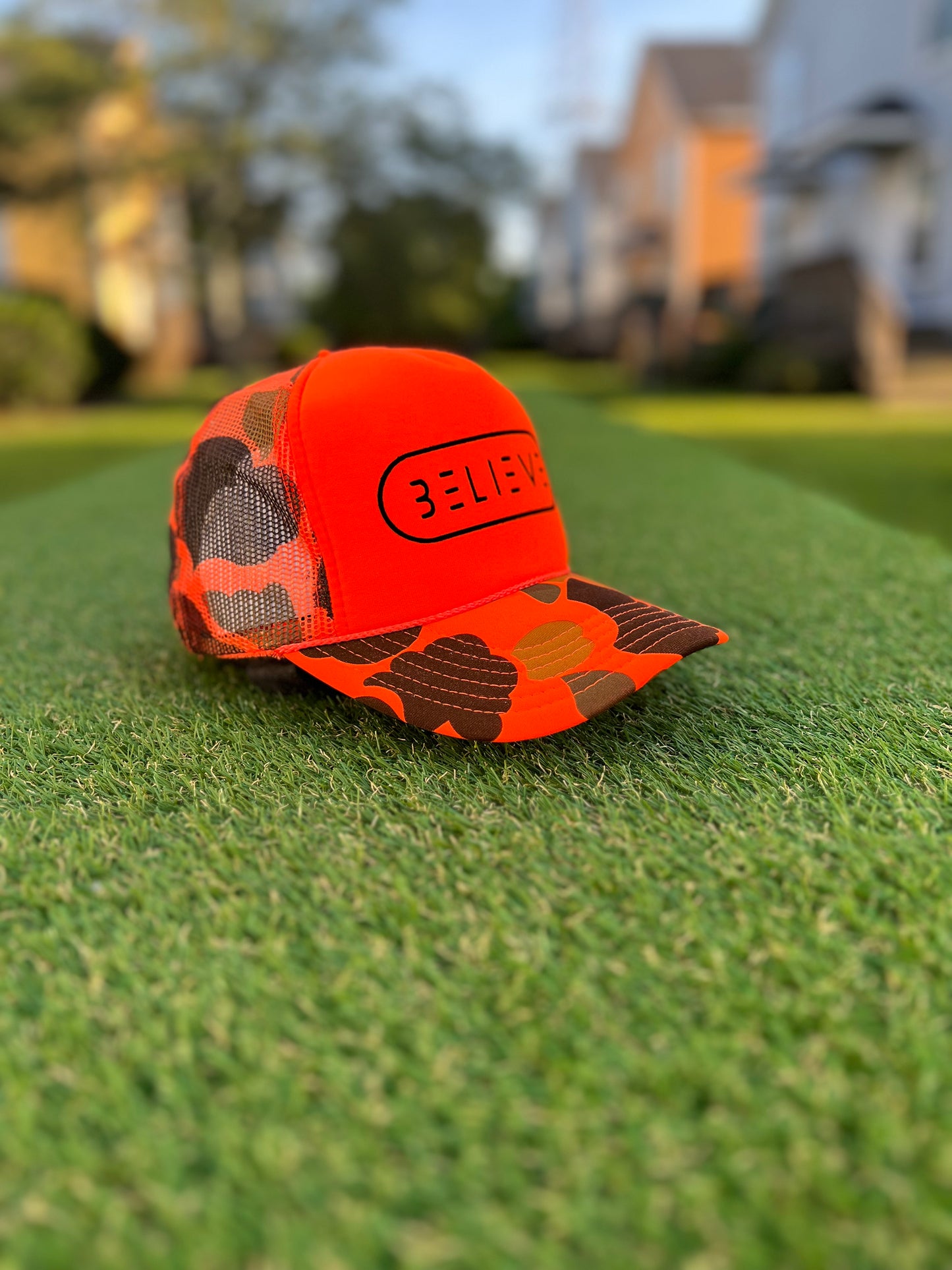 Orange Camo BELIEVE Trucker Hat